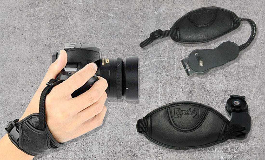 hand holding camera with wrist strap attached