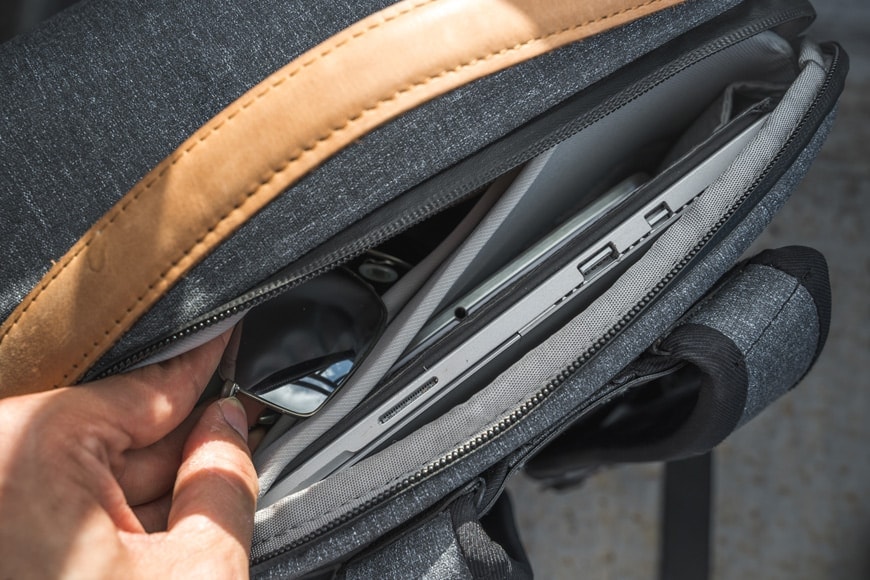 You'll find the access point to the soft top pouch along with the laptop, document, and tablet pouch on the top of the Everyday Backpack V2.