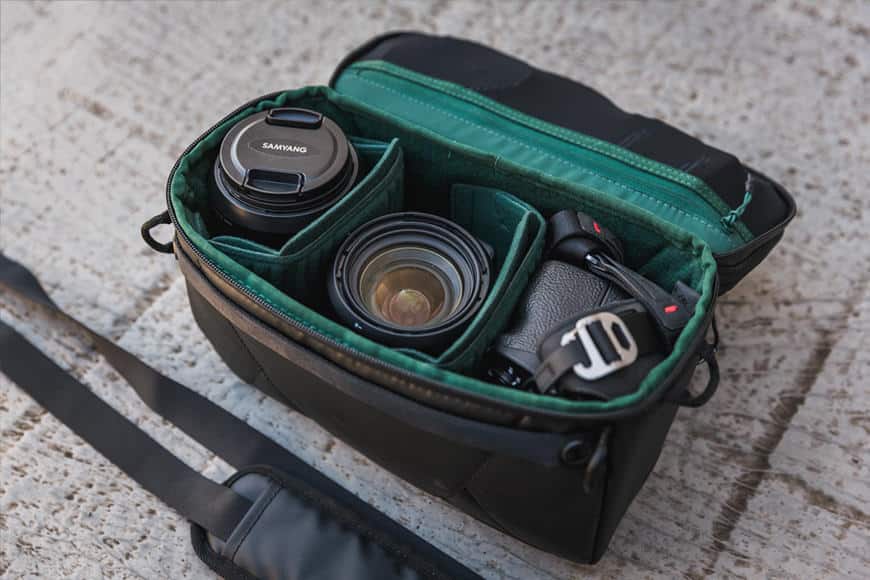 The Built-in Pouch can hold 2 lenses and a mirrorless body, or a fold up drone with controller, spare batteries, and more!