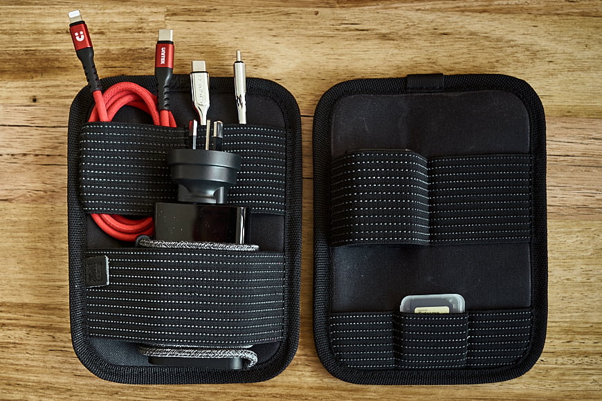 On the left, a laptop organiser carrying my laptop power cable and various other cables. On the right, camera organiser carrying spare batteries and SD cards.