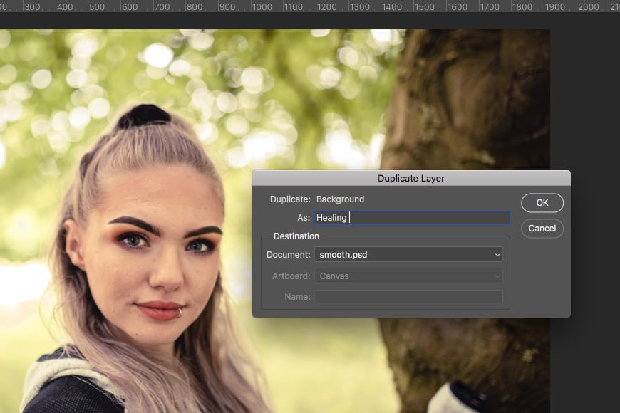 Tutorial on how to smooth skin in Photoshop - step 1 is to duplicate layer via the layers panel.