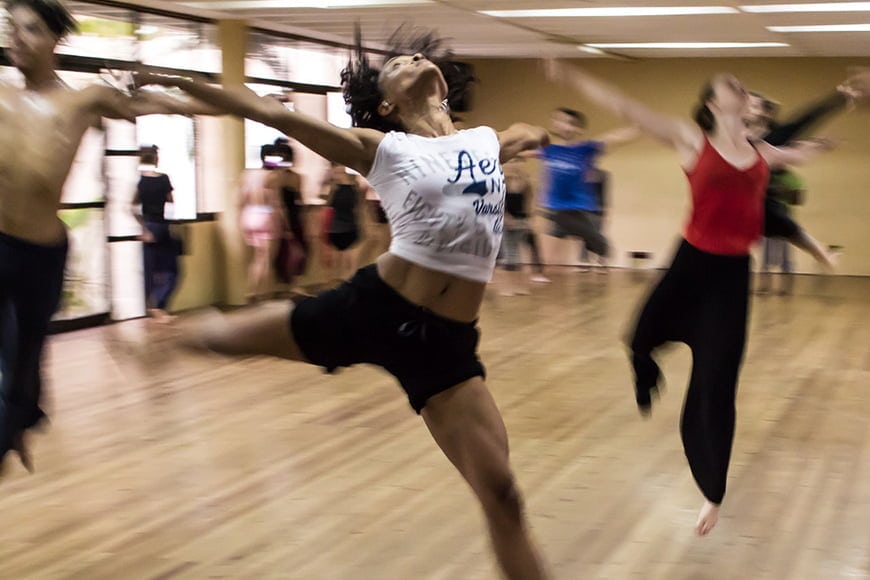 Dancers rehearsing with blur of motion.