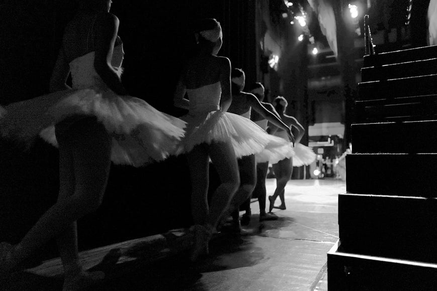 Ballerinas backstage in tutus.