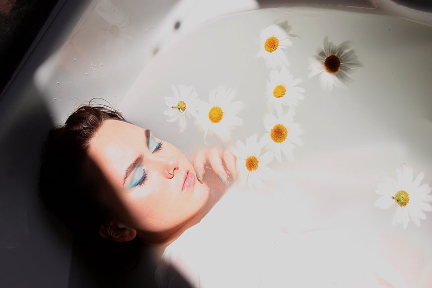 In milk bath photography you can use window light to light the tub for a bath shoot