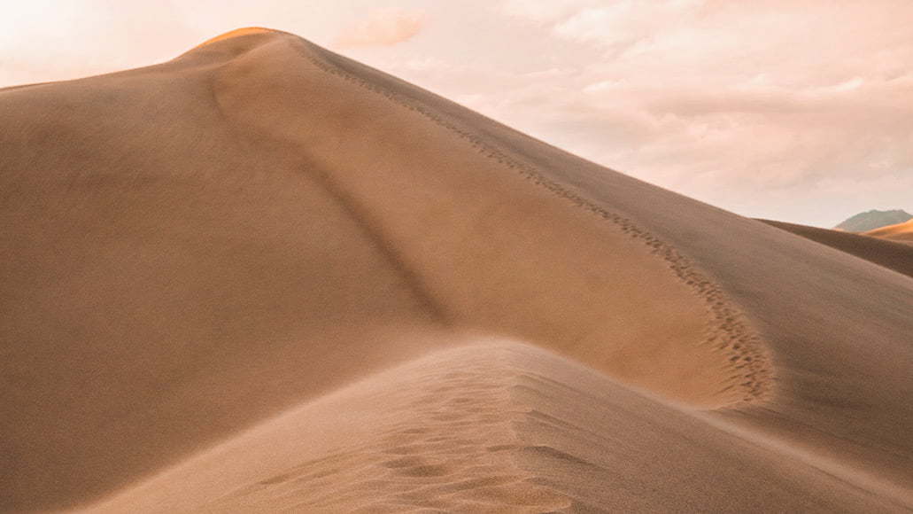 Landscape photography of sand dune hills 