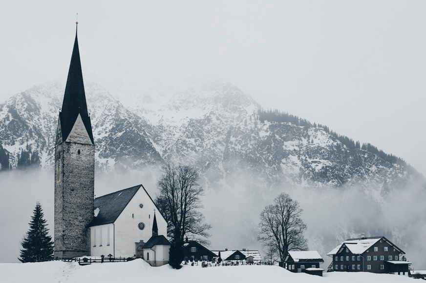 Snowy mountain behind a church