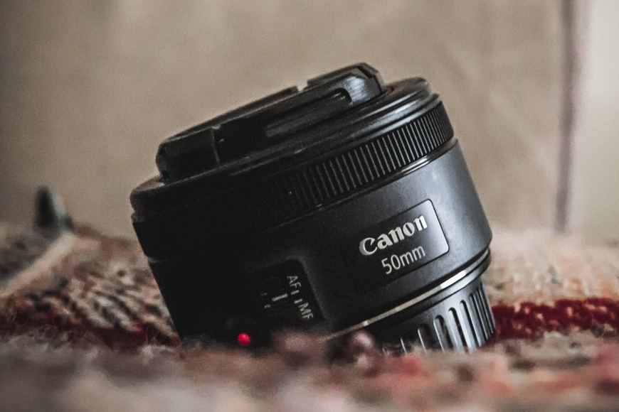 Try a 50mm instead of expensive consumer zoom lenses.