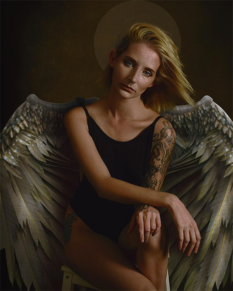 Angel or fairy wings on a female model portrait.