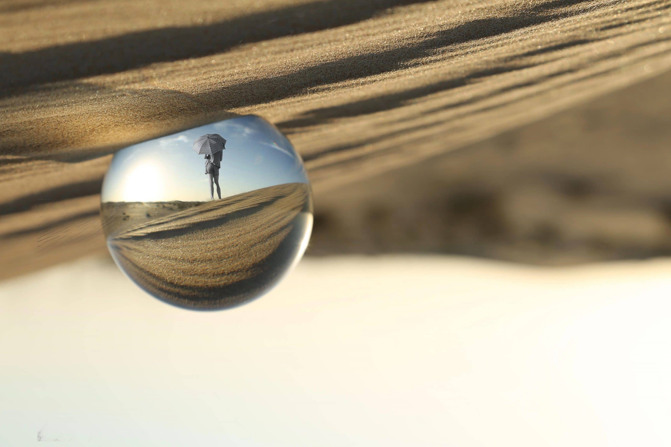 crystal ball in sand