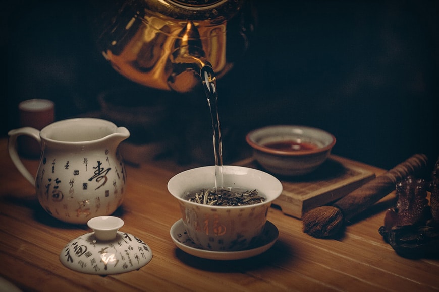Tea being poured into cup