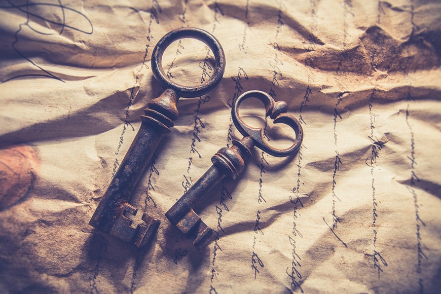 Old fashioned keys on crinkled paper