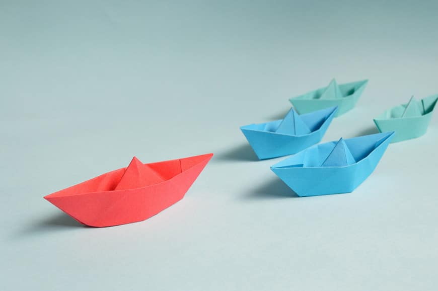 Photo of red and blue paper boats