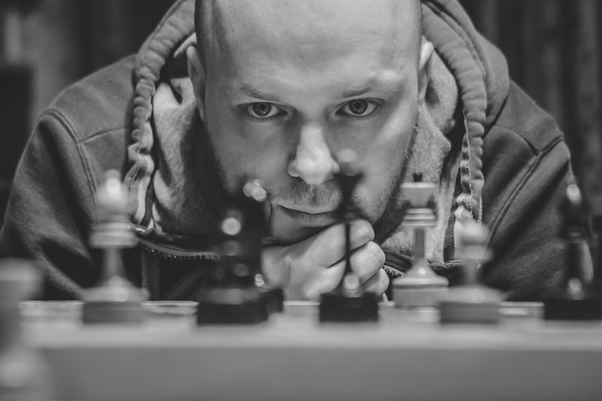 Man closeup across chess board