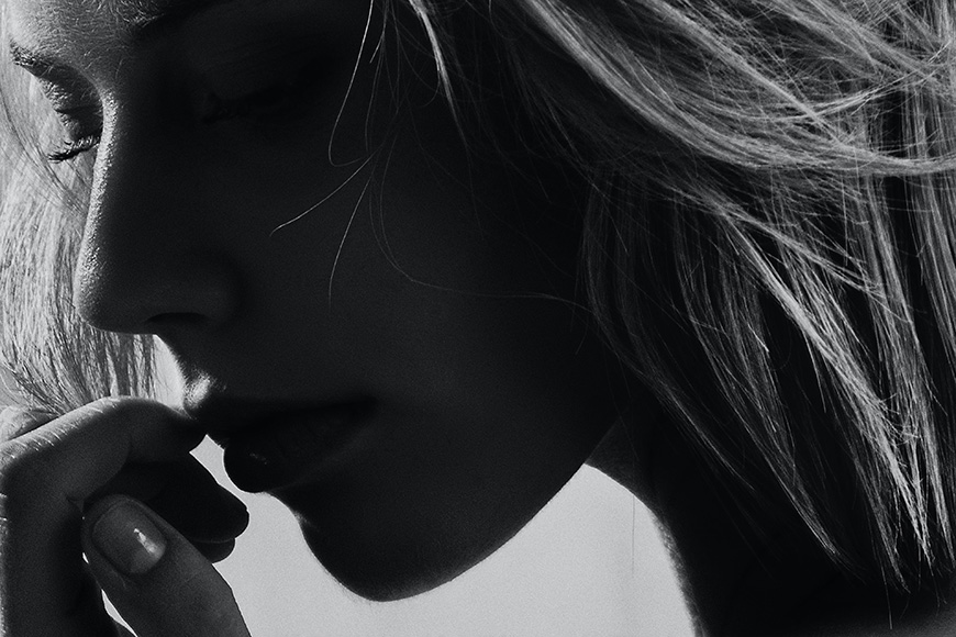 Close up of a women touching her lips