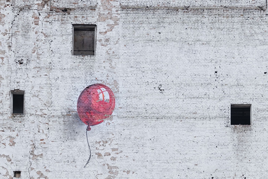 Street art of red balloon