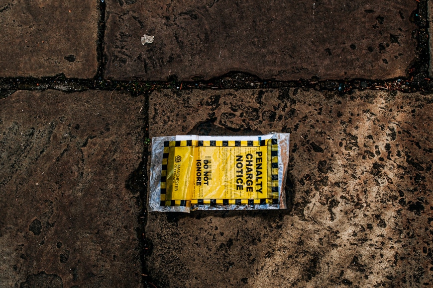 urban photography - dirty parking ticket on the ground
