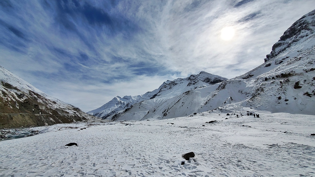 Snow-covered landscape with blue sky an clouds