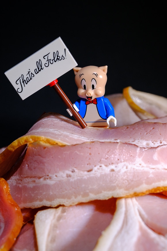 Porky pig sitting in bacon
