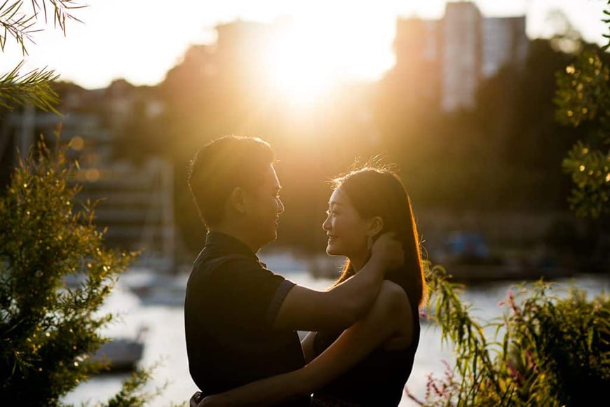 Pre wedding photo of engaged couple in golden light