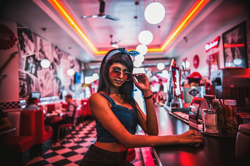 Girl posing in retro style diner
