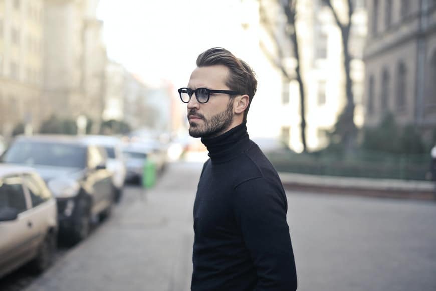 Man with glasses and black turtleneck