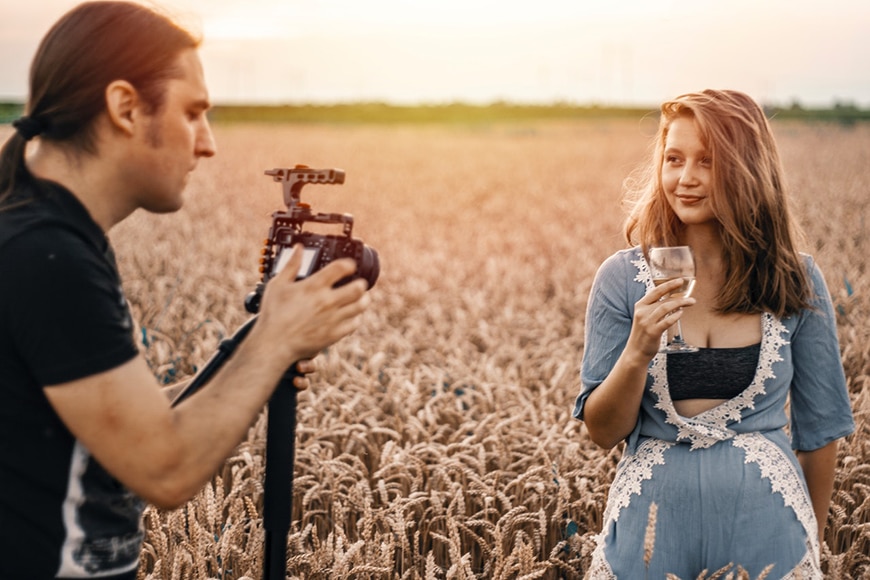 Photographer taking professional pic of girl