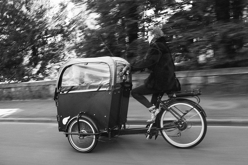 Woman riding bike with motion blur
