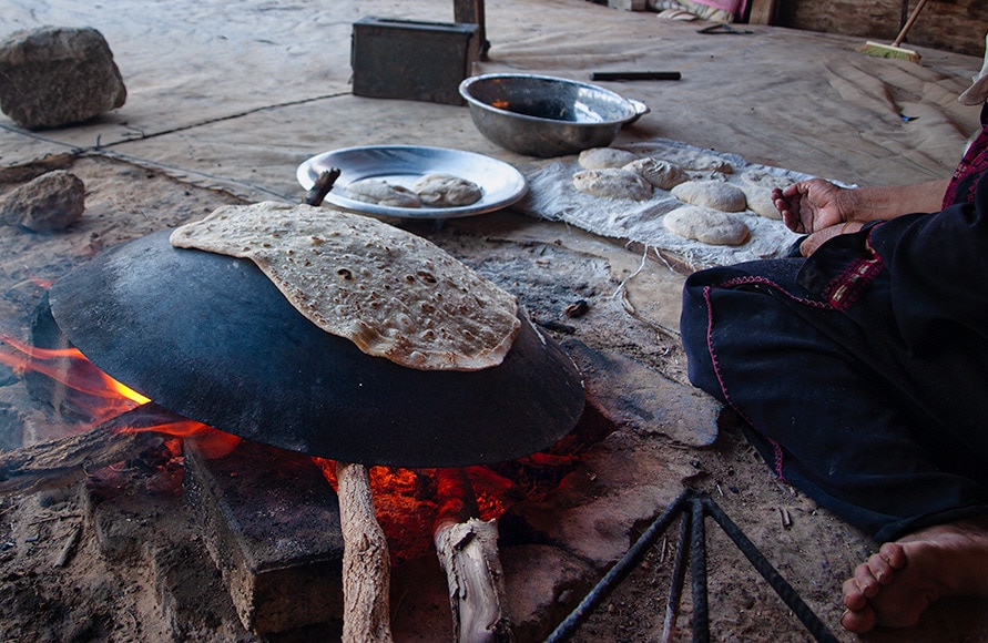 Bedouin woman making flatbread