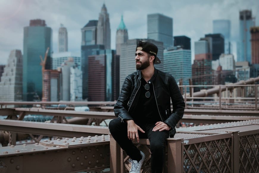 Hipster Male Model in Casual Clothes Poses Confident on Street Near  Buildings. Student Traveling in New City Concept. Stock Image - Image of  happy, male: 148835567