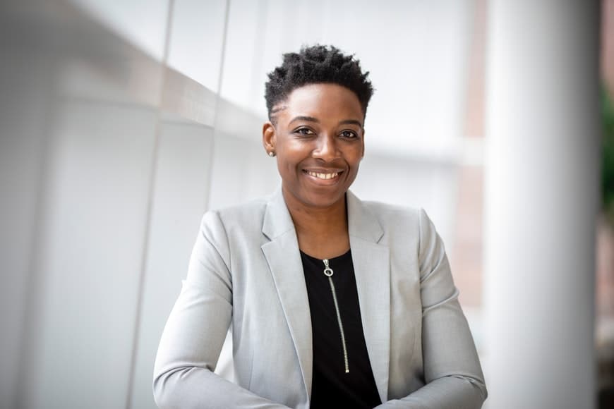 Serious Confident Business Professional Posing Near Office Building. Young  African American Business Woman Touching Chin And Looking At Camera. Female  Professional Portrait Concept Stock Photo, Picture and Royalty Free Image.  Image 128830134.