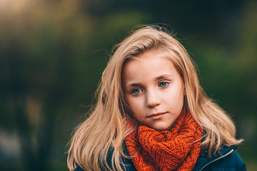 Little girl in orange scarf