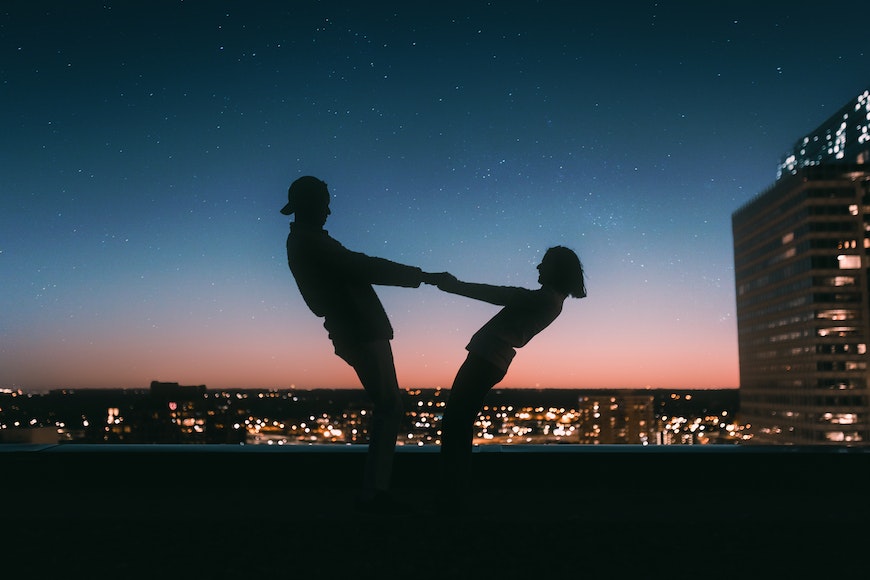Couple holding hands standing on road during sunrise photo – Free Love  Image on Unsplash