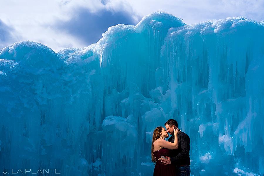 couple hugs in front of ice wall