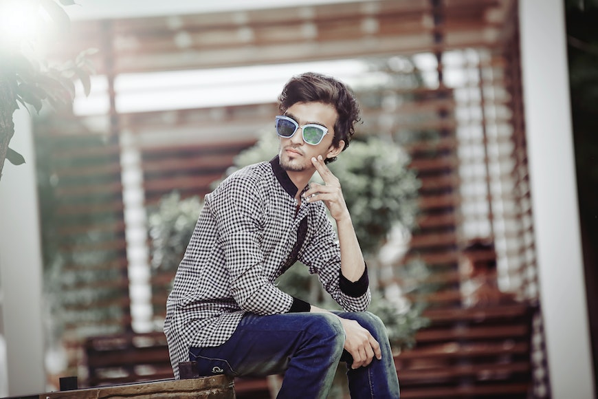 Young handsome man in retro style suit posing sitting on a stool Stock  Photo - Alamy