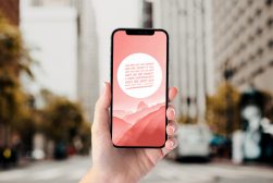 phone in hand with app to add text to photo