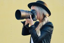 photo of woman shooting with Nikon camera