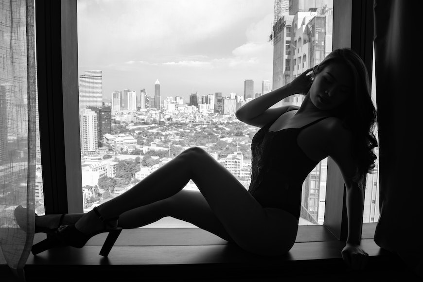 Window silhouette with lingerie and heels