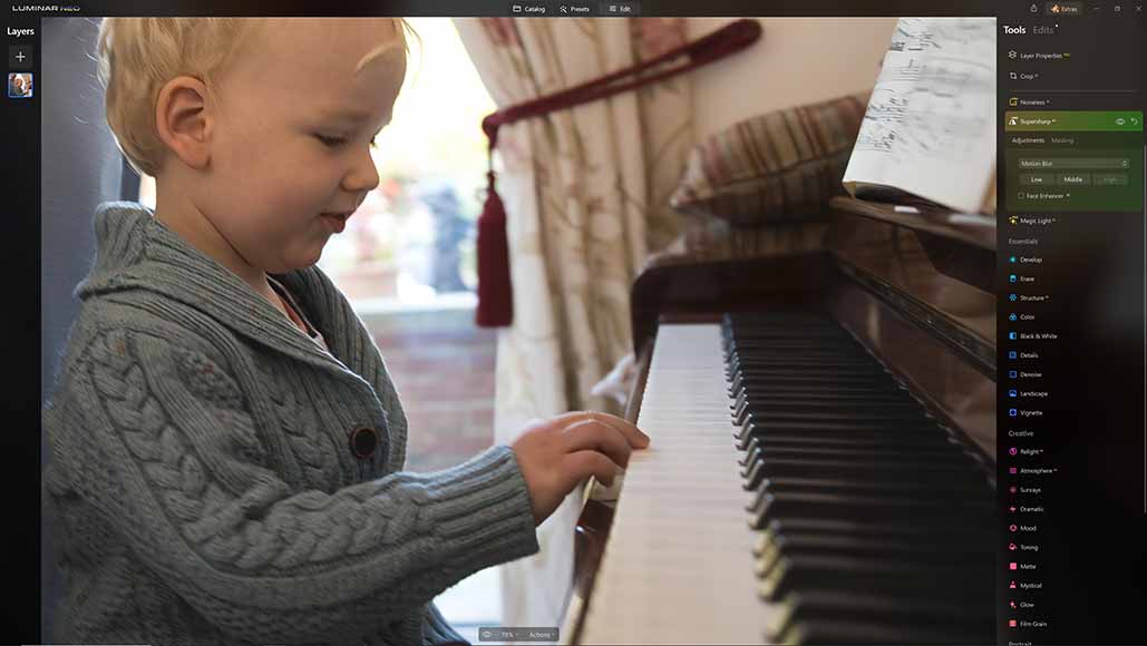 A sharpened image of a boy playing the piano