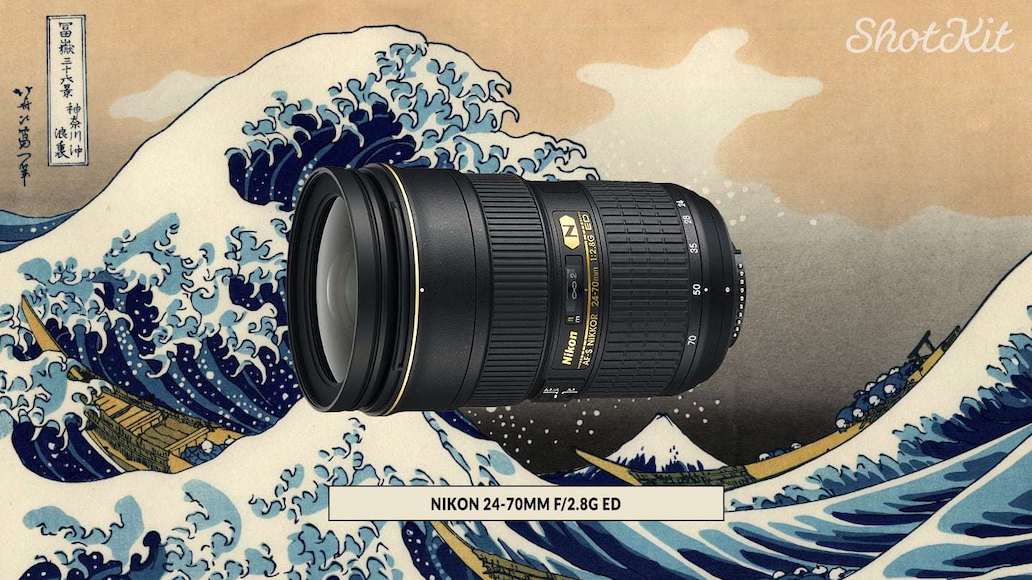 a camera lens sitting on top of a large wave.