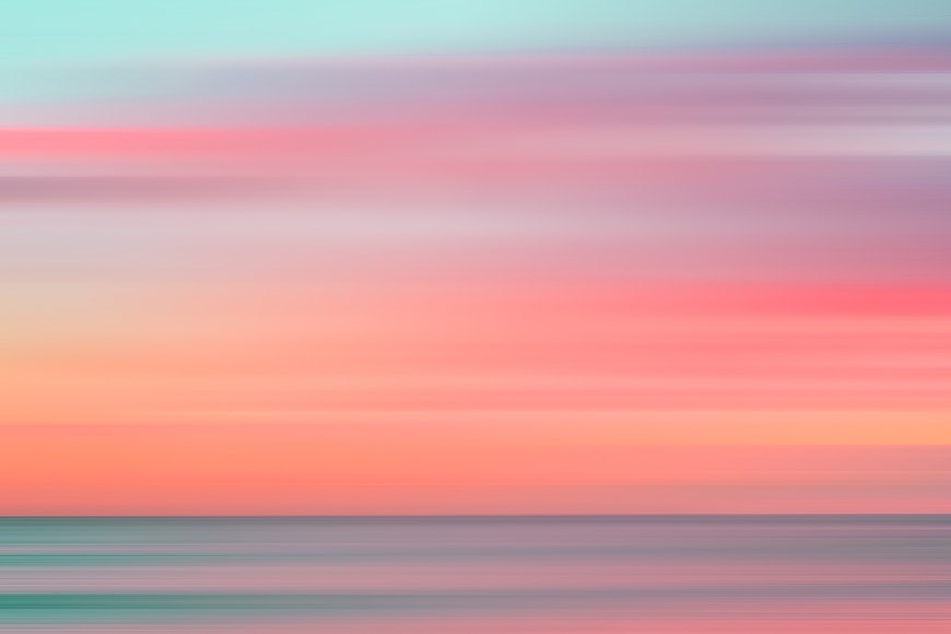 a blurry photo of the ocean and sky.