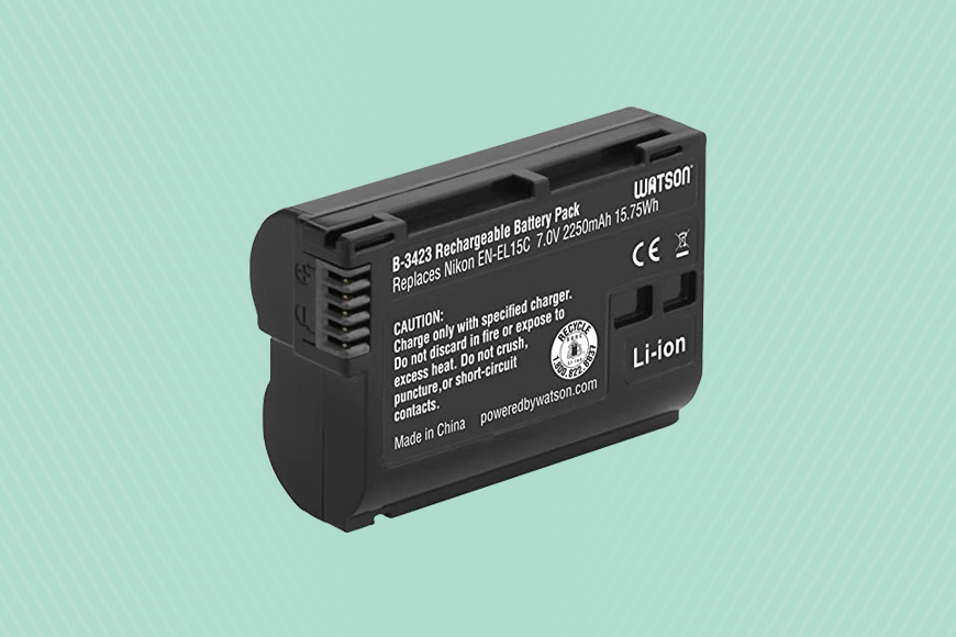 a battery for a camera on a green background.