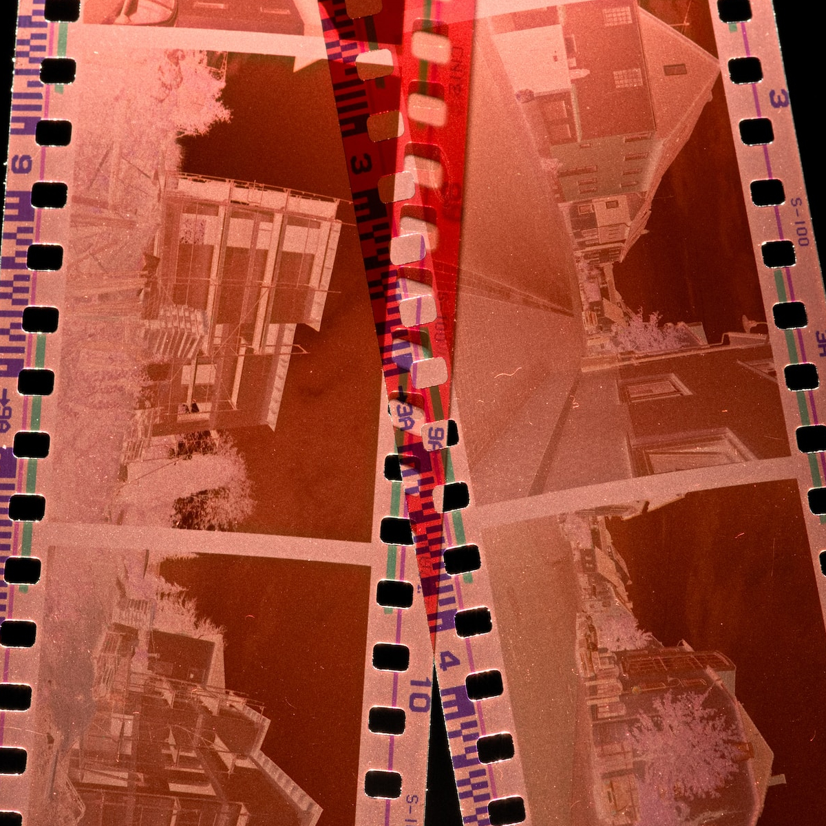a film strip with a picture of a city in it.