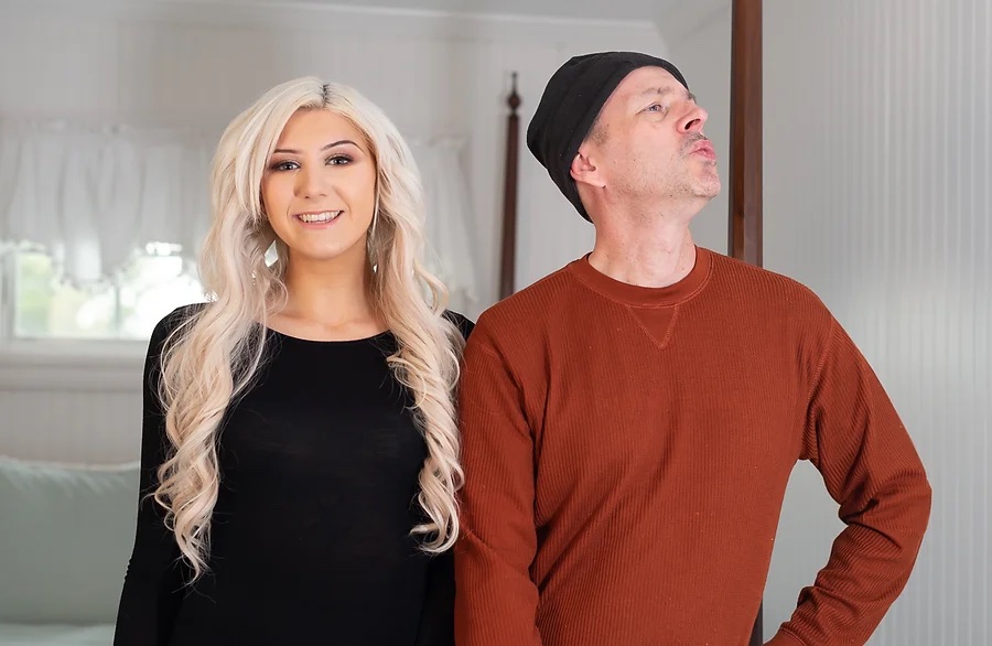 a man and a woman standing next to each other.
