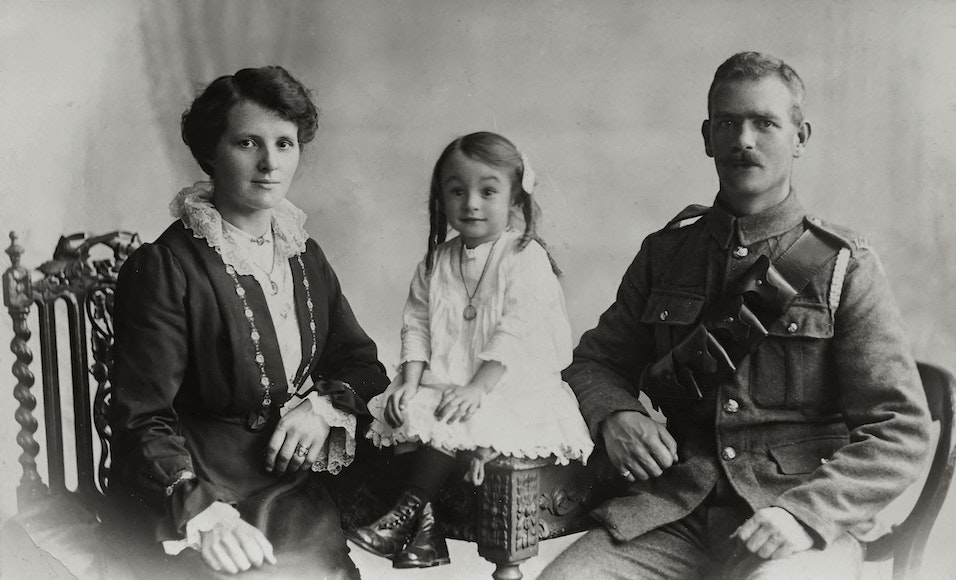 an old black and white photo of a family.