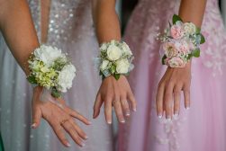 Close up to hands with corsages