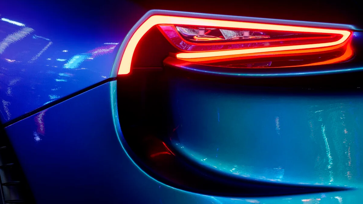 the tail light of a blue sports car.