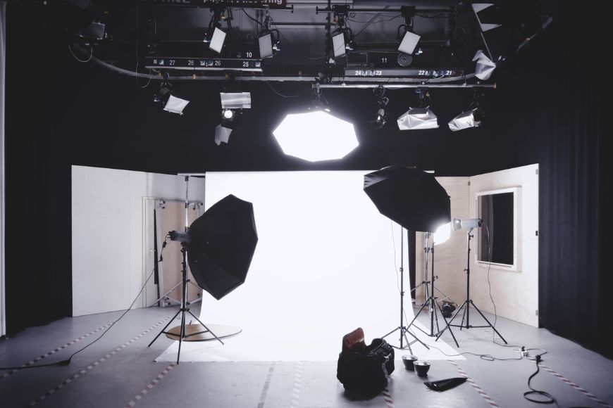 a photo studio with lights and lighting equipment and flash diffusers