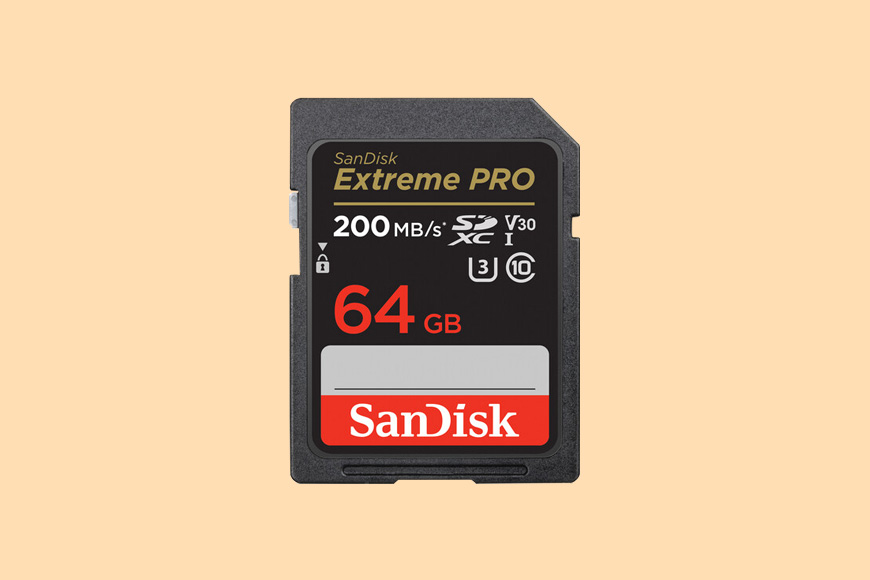 a sandisk extreme pro memory card on a yellow background.