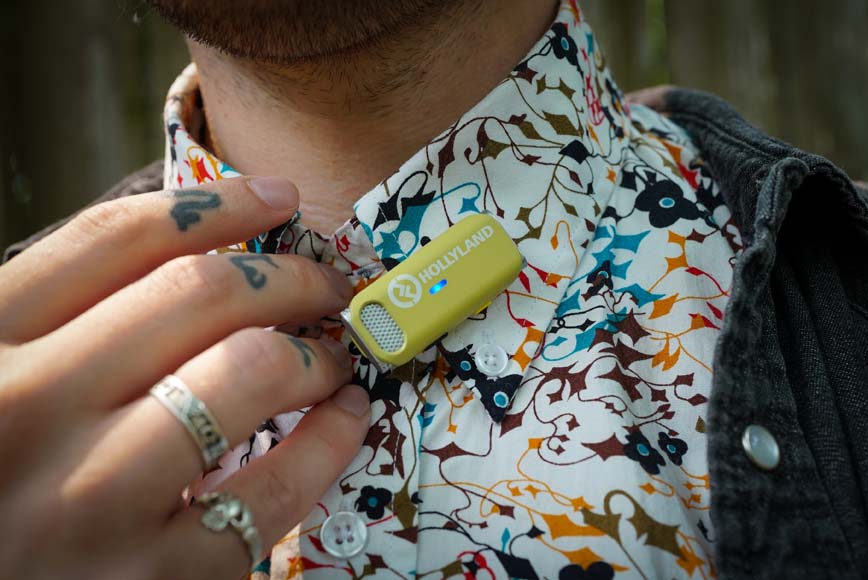 wireless receiver attached to man's shirt collar