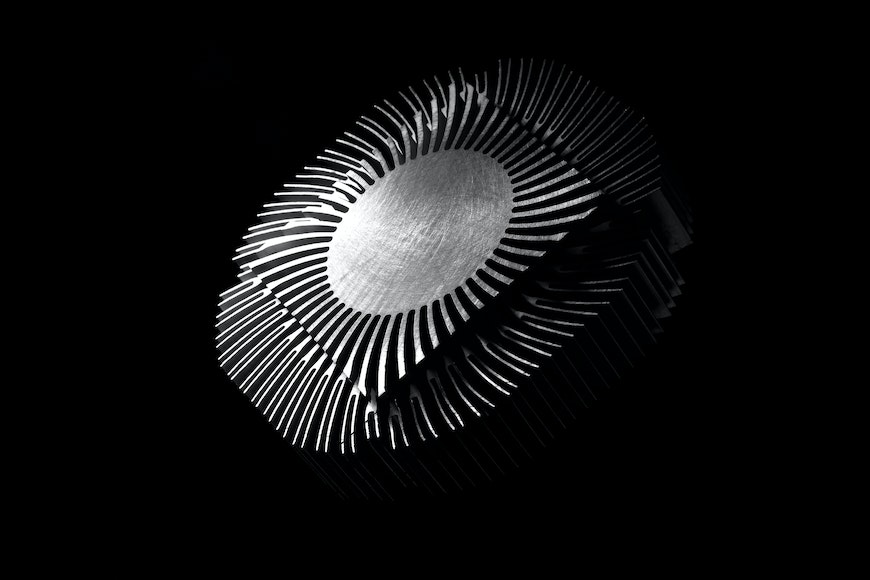 a black and white photo of a metal object.